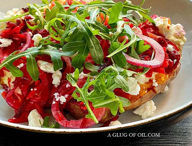 Oven baked sweet potato with feta, beetroot and carrot.