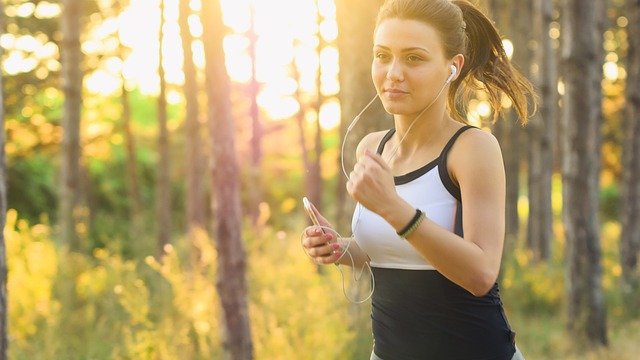 Beautiful woman running in a park