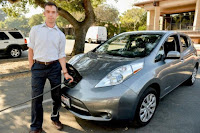 Researcher Matthew Pellow charges his all-electric Nissan Leaf at Stanford. Pellow has found that battery electric vehicles are a more cost-efficient choice for reducing carbon dioxide emissions than cars powered by hydrogen. (Credit: Mark Shwartz/Stanford University) Click to Enlarge.