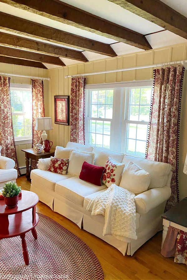 White Sofa and Red Accents In Living Room