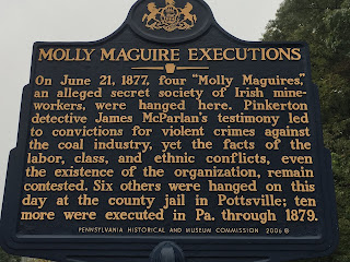 Molly Maguire Executions. On June 21, 1877, four "Molly Maguires," an alleged secret society of Irish mineworkers, were hanged here. Pinkerton detective James McParlan's testimony led to convictions for violent crimes against the coal industry, yet the facts of the labor, class, and ethcnic conflicts, even the existence of the organization, remain contested. Six others were hanged on this day at the county jail in Pottsville; ten more were executed in Pa. through 1879.