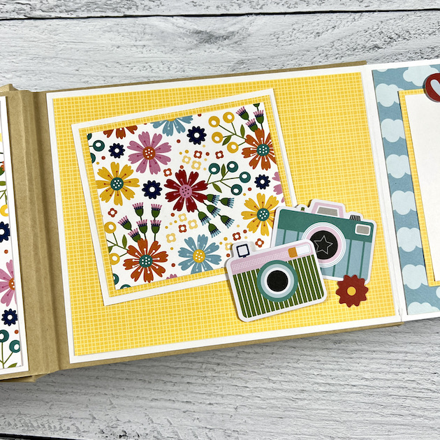 Travel scrapbook album page with camera & flower for vacation photos