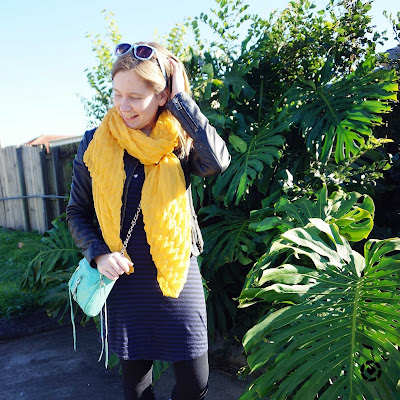 awayfromtheblue Instagram | mustard scarf, navy stripe tee dress leather jacket and aqua mini mac bag winter colourful accessories