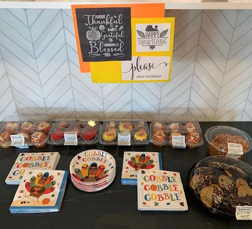 Cupcakes and cookies at One Wall St with Thanksgiving napkins for residents