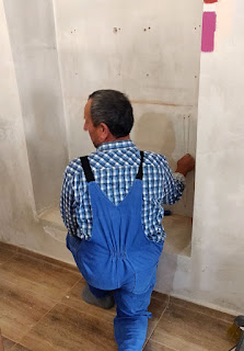 Bekir removing wall plugs and tidying|