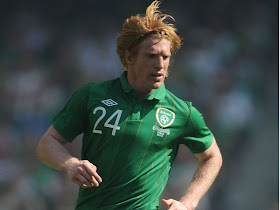 Republic of Ireland defender Paul McShane, giving it socks for his country