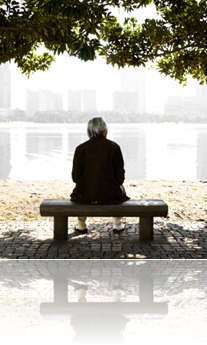 Senior Man Sitting on a Park Bench