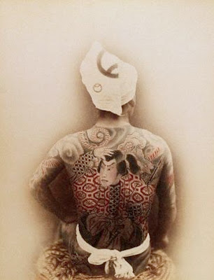 A Japanese man's back full of big Japanese warrior tattoo.