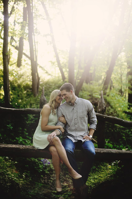 couple on bridge for engagment pictures in sioux city