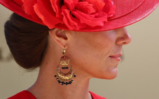 The Princess of Wales wore a red dress by Alexander McQueen. The Duchess of Edinburgh wore a pink dress. Princess Beatrice