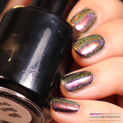 Swatch of Born Pretty Store peacock holographic nail powder item #40683 over black nail polish