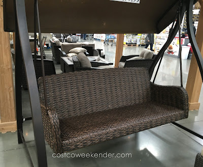 Relax outside in the comfort of the Agio International Woven Patio Swing