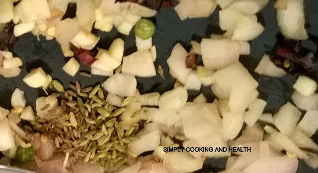Adding cumin seeds, fennel seeds