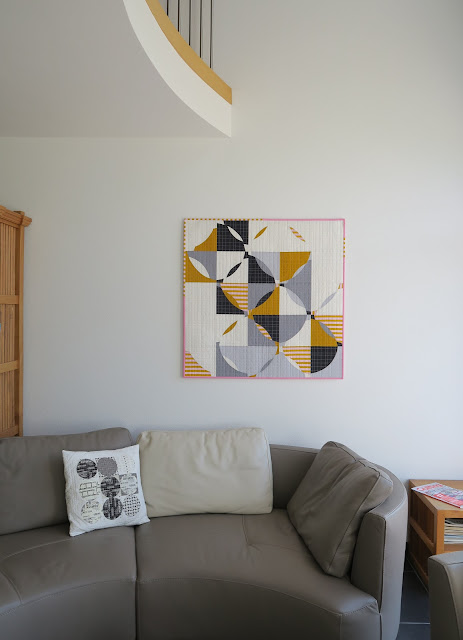 Luna Lovequilts - Free Form Curve quilt hanging in my living room