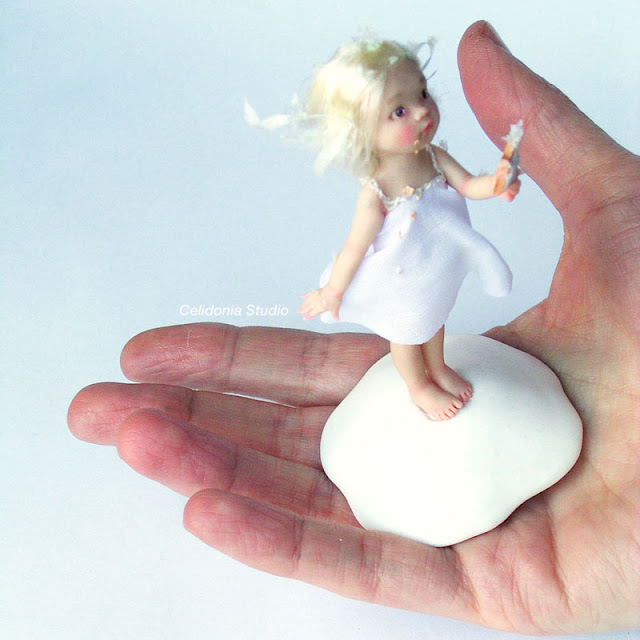 Miniature art doll snow girl