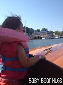 Baby riding on a boat