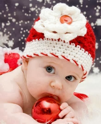 baby in red dress