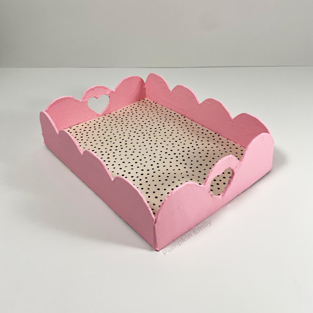 A pink cardboard tray.