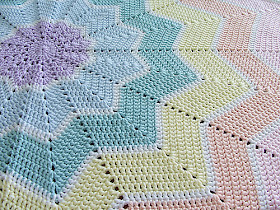 http://www.ravelry.com/patterns/library/rainbow-ripple-baby-blanket