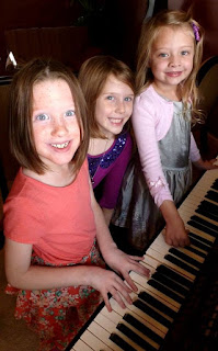 THree family members enjoying playing a Kawai CP baby grand digital piano