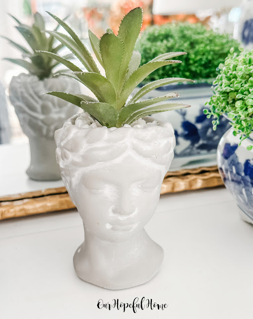 mini Grecian head planter with succulent