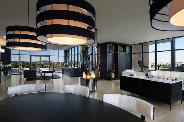 Picture of black and white modern penthouse interior as seen from the dining table