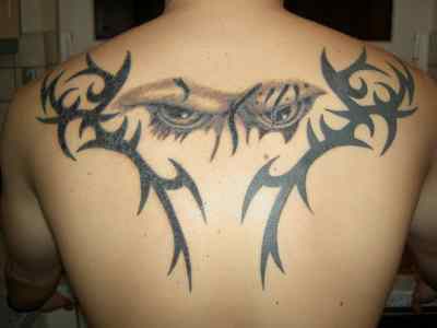 Tribal flying phoenix upper back design Tribal tattoo upper back
