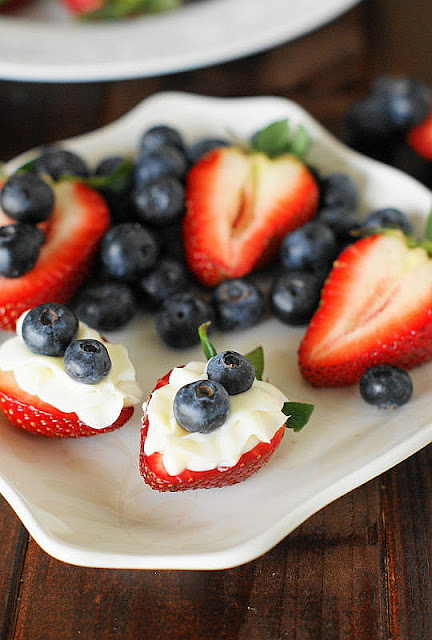 Red White & Blue Strawberry Cheesecake Bites on Dessert Plate Image