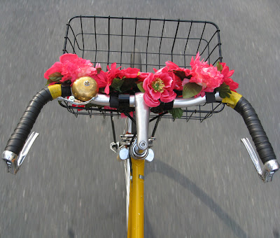 rolling with flowers on her bike