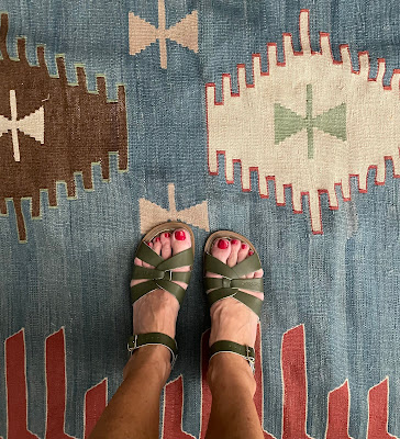 A view of feet wearing salt water sandals