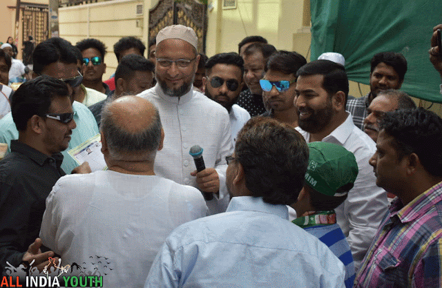 Asaduddin Owaisi poster inteacrting with people