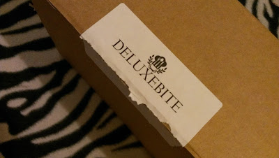 Deluxebite box & ripped sticker