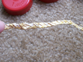 Three strand plaited/braided straw.