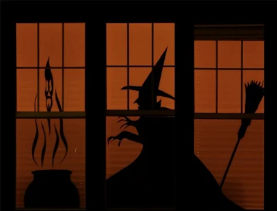 spooky witch, broom, and cauldron halloween silhouettes in window