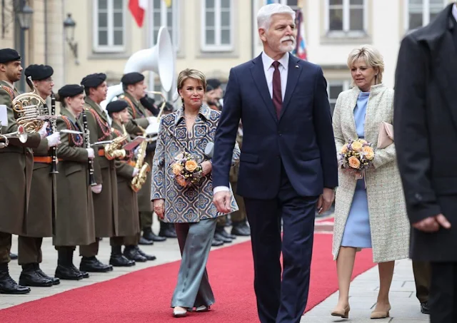 President Petr Pavel and First Lady Eva Pavlova. Duchess Maria Teresa wore a velvet stitch jacquard pea coat by Etro