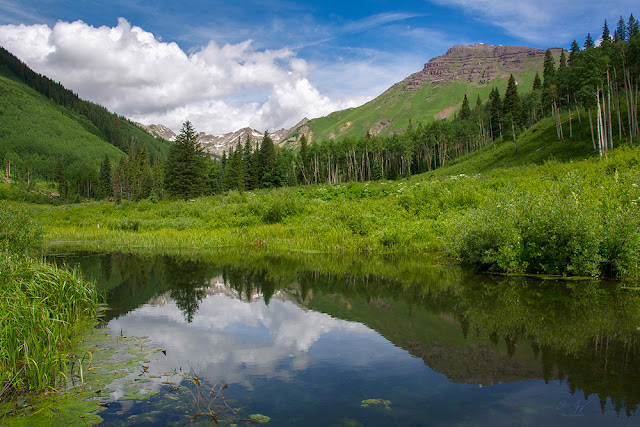 Teocalli Mountain reflected in a small pond near Crested Butte, Colorado