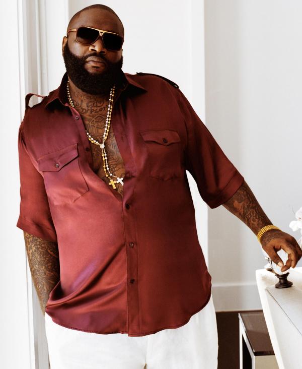 rick ross tattoos on his hand. rick ross tattoos pics.