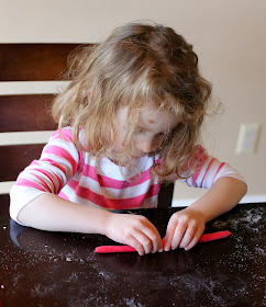 Old Fashioned Candy Cane Ornaments - a great first ornament for toddlers to help make!  From Fun at Home with Kids