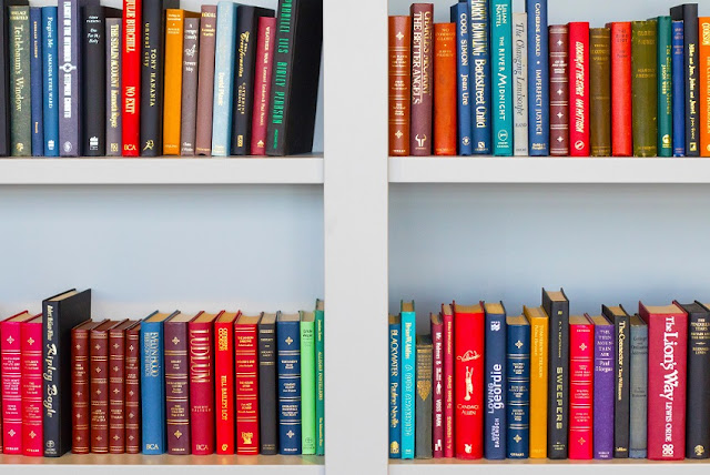 Rows of colourful books on a bookshelf