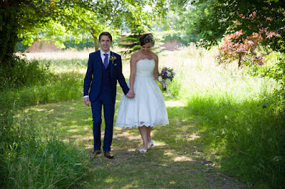 Bride and Groom walking hand in hand