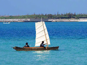 two man sailing sabani boat