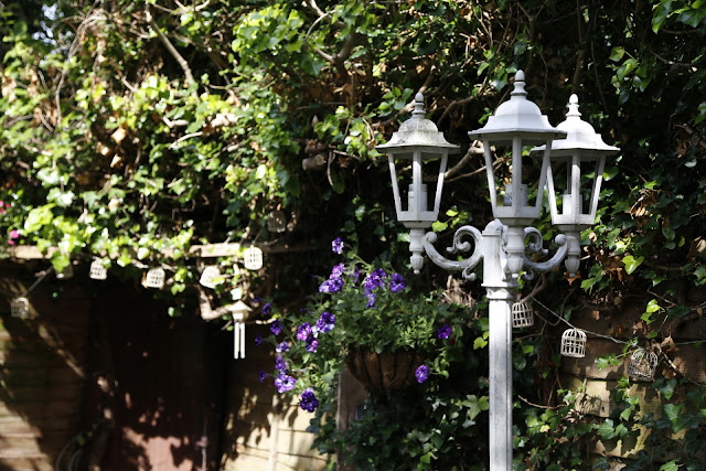 Shabby Chic White Antique Lamppost in Garden