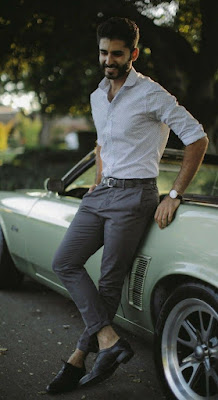 A man is standing in formal wear looking great