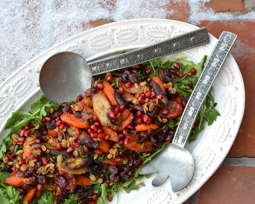 Celebration Salad (Maple-Roasted Carrots with Arugula, Dill, Cranberry Vinaigrette, Pomegranate and Glazed Pecans), an exultant platter of vegan texture, color, flavor and mood ♥ KitchenParade.com