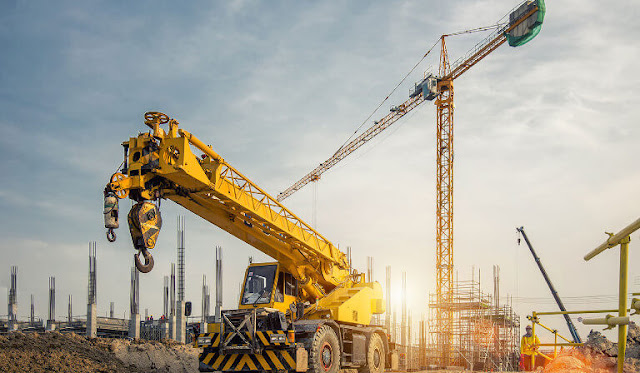 Cranes and unfinished building  