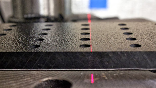 Alignment test of the camera stabilizer mounting holes, showing the high precision machining