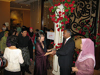 Sara's parents greeting guests