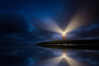Lighthouse at night Photo by Evgeni Tcherkasski on Unsplash