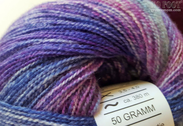 Tweedy and colorful yarn with a nice halo will hold its own against the mohair.