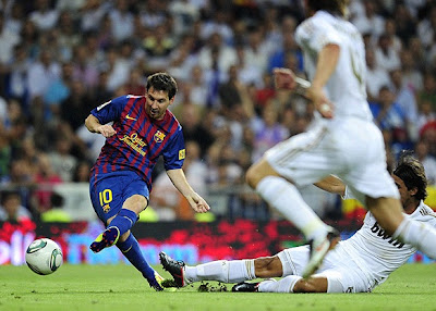 Messi scoring a goal against Real Madrid